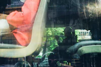 a person sitting in a seat on a bus