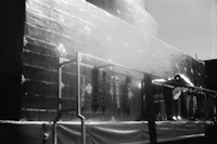 a black and white photo of a building under construction