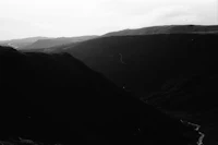 a black and white photo of a mountain